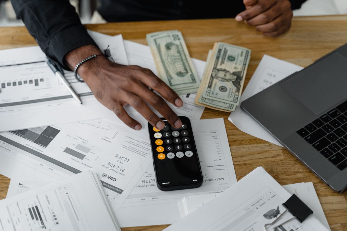 Overhead view of financial documents and calculator on a desk