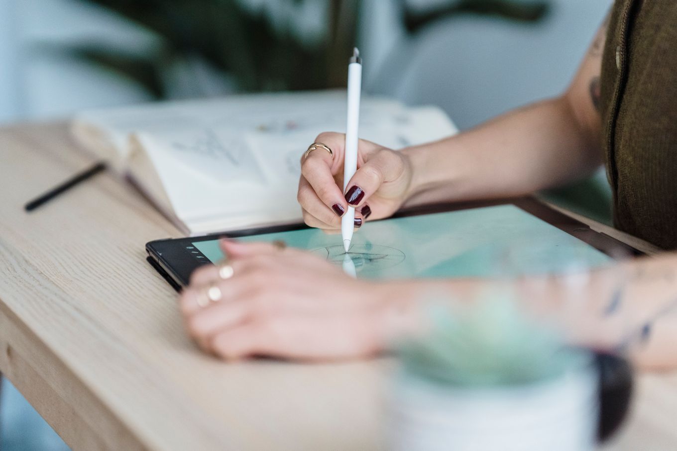 Designer sketching on a graphics tablet with a stylus